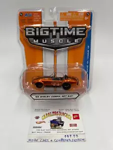 Jada Big Time Muscle Wave 18 65 Shelby Cobra 427 S/C arancione/nero 184G - Foto 1 di 7
