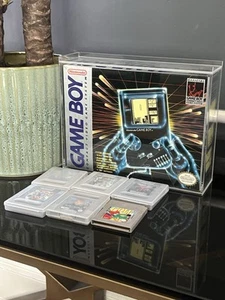 1988 Game Boy was a revolutionary handheld gaming device developed by Nintendo. - Picture 1 of 3