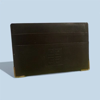 Tarjetero Givenchy vintage de cuero negro con detalles dorados Foto 1 de 4