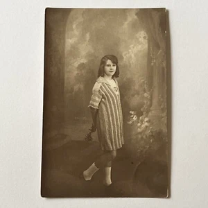 Antique RPPC Real Photograph Postcard Lovely Girl Flower Forest Backdrop - Picture 1 of 9