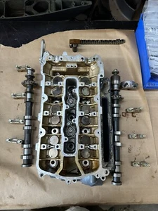 2004 YAMAHA F 225 PORT CYLINDER HEAD PN# 69J-11120-01-94 / PN# 69J-W009C-02-1S - Picture 1 of 23