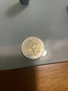 Moneta 2 euro Olimpiadi Di Atene 2004 RARA-ERRORE Conio BRACCIO PIU LUNGO - Foto 1 di 3