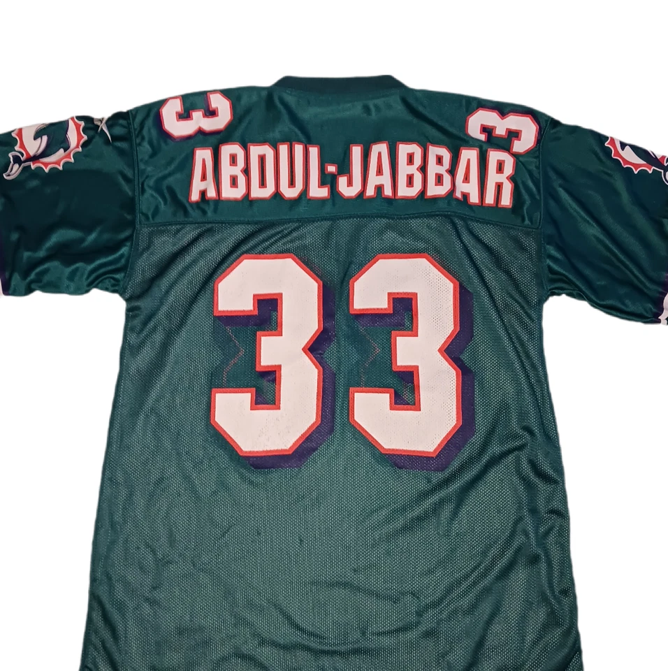 Camiseta Reebok Kareem Abdul-Jabbar Miami Dolphins Reversible Niños Mediana NFL Foto 1 de 4