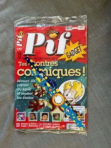 PIF GADGET NOUVELLE SÉRIE N°13 LES MONTRES COSMIQUES EN ÉTAT NEUF SOUS CELLO - Imagen 1 de 4