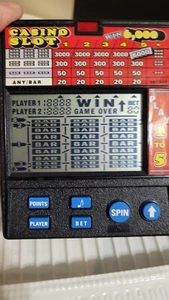 - ♡♤◇♧ -CASINO SLOT HANDHELD POCKET GAME MODEL 1470 IN ORIGINAL BOX -HAVE FUN!- - Picture 1 of 5