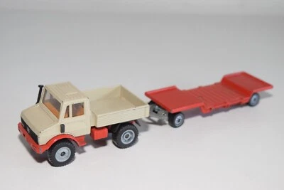 A35 1:55 SIKU MERCEDES-BENZ UNIMOG CON RIMORCHIO PIANALE RIBASSATO OTTIME CON... - Immagine 1 di 4