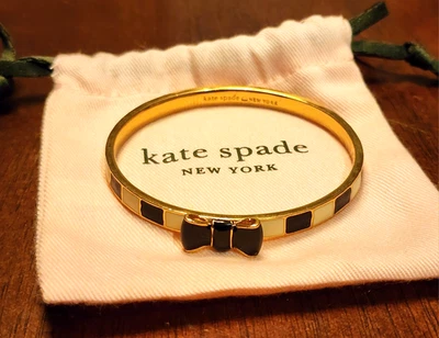 KATE SPADE NEW YORK Take a Bow Gold, Black & White Bangle Bracelet & Gift Bag - Image 1 of 4