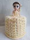 hand knitted yellow toilet roll doll cover