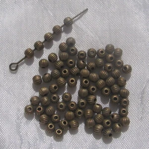 J152 - SET MIT 80 ABSTÄNDEN 4 MM RUNDE PERLEN BRONZE LOCH 1 MM NICKELFREI - Bild 1 von 4