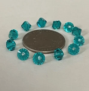 (12) 6mm Swarovski Crystal Bicone Beads 5328- BLUE ZIRCON - Imagen 1 de 1