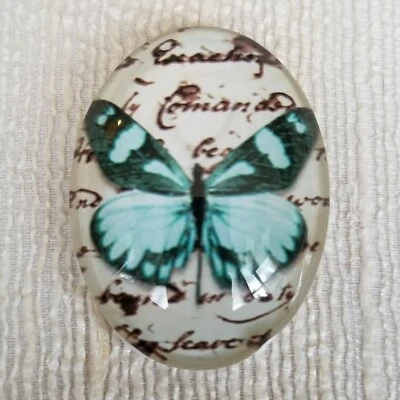 Steampunk Victorian Butterfly Old Script Blue Multi Glass Oval Cabochon 40x30mm - Image 1 of 3