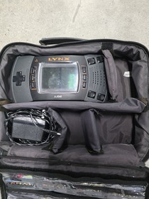 Atari Lynx Console with Game Cartridges, and  Carrying Case & Power Adapter
