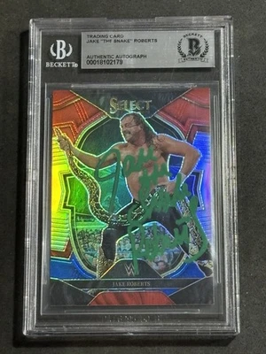 JAKE “THE SNAKE” ROBERTS 2023 PANINI SELECT WWE RED & BLUE PRIZM AUTO CARD BAS - Image 1 of 2