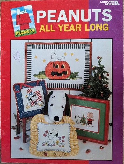 PEANUTS ALL YEAR LONG LEISURE ARTS CROSS STITCH BOOK SNOOPY ALL HOLIDAYS - Image 1 of 4
