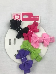 5 neue Clippies Haarschleifen Hund Baby Kleinkind schwarz pink grün lila - Bild 1 von 4
