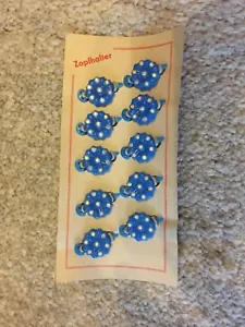 orig.DDR Zopfhalter/Zopfgummi's- Reste v.Hersteller, incl.n.Gummi's,80'er J 17. - Bild 1 von 1