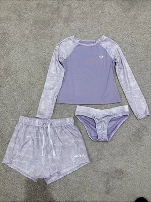 Conjunto de natación Roxy para niñas púrpura 3 piezas UPF 50 protección contra erupciones bikini parte inferior pantalones cortos Foto 1 de 4