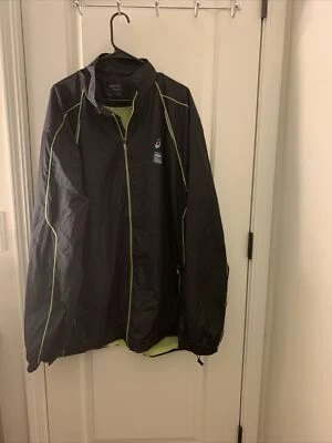 Chaqueta cortavientos con cremallera negra Asics para hombre Foto 1 de 4
