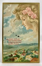 Woman Appears Over Village w/ Roses In Hair | Embossed Gold Gilt | Postcard 1900
