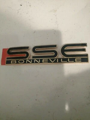 1994-1995 Pontiac Bonneville SSE Door Emblem Nameplate  Black & Gold - Image 1 of 2