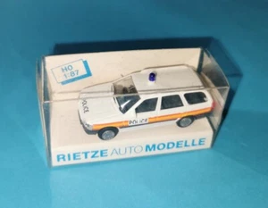 Ford Escort Kombi Police GB Rietze 50380 pista H0 - Imagen 1 de 3