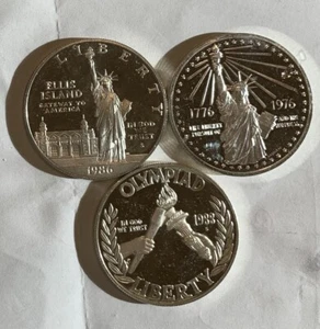 1986 ELLIS, 1988 OLYMPIAD, 1976 REVOLUTION PROOF SILVER LIBERTY COINS - Picture 1 of 2