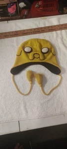 Cartoon Network ADVENTURE TIME Jake & Finn. JAKES Mütze Beanie gelb mit Seilbändern - Bild 1 von 4