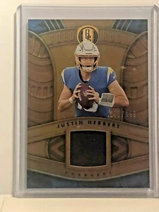 2021 Panini Gold Standard Gold Rush Materials #26 Justin Herbert /199 - Bild 1 von 2