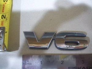 V6 LETTERS EMBLEM CHROME BAGDE OEM USED ORIGINAL W FREE SHIPPING - Picture 1 of 1