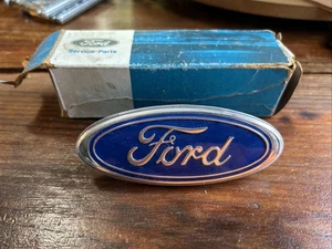 85-89 FORD ESCORT GRILL GRILLE EMBLEM NAME PLATE E6FZ-8A223-A NOS OEM - Picture 1 of 7