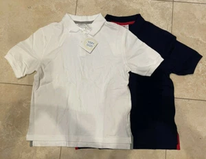 Juego de 2 camisas polo de manga corta HANNA ANDERSSON para niños talla 150 azul marino/blanco nuevas con etiquetas - Imagen 1 de 5
