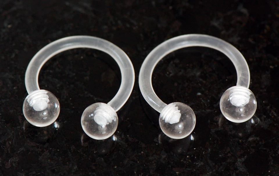 Par de barras circulares de herradura de bola de 14 g 1/2" 5 mm flexibles acrílicos transparentes  Foto 1 de 3