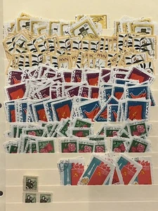HUGE VIETNAM INVESTORS LOT OF STAMPS STUFFED IN A STOCK PAGE, FLAGS, FLOWERS - Picture 1 of 8