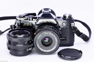 canon AE-1 black film camera kit with 35mm and 50mm lenses ! - Photo 1/13