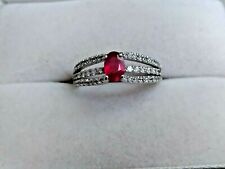 14k white gold ruby ring with white zircon accent stones