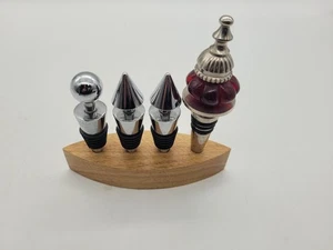 Set of four wine stoppers with wooden stand - Picture 1 of 9