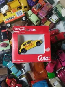 YELLOW VW BUG BEETLE COCA COLA 1/64 SCALE NEW IN THE BOX - Picture 1 of 1