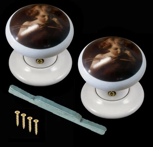 1 Pair White Porcelain Mortice Door Knob Set Cherub Design - Picture 1 of 1
