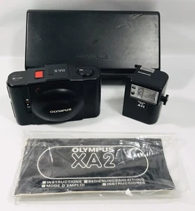 Fotocamera Olympus XA2 + flash classe pellicola 35 mm fotografia vintage anni '80 Giappone - Foto 1 di 23