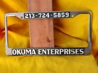 Rare ”Okuma Enterprises"Los Angeles CA.... Metal Licence Plate Frame. Pre-owned
