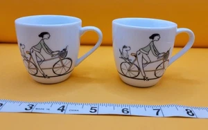 Sur La Table White Porcelain Coffee Mini Mugs Set of 2 Girl Riding Bike - Picture 1 of 10
