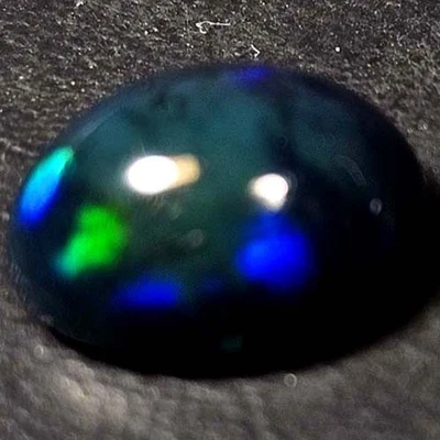 NATURAL AAA+ GENUINE COLOR PLAY OVAL CABOCHAN  ETHIOPIAN WELO BLACK OPAL 1.50CTS - Image 1 of 3