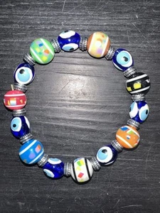 Pulsera Mal de Ojo Multicolor Cuentas Elastizadas Tono Plata Espaciadores - Imagen 1 de 8