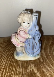 Estatuilla de violonchelo vintage para niña jugando porcelana - Imagen 1 de 2