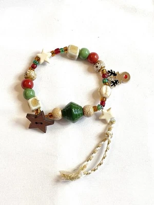 Caprichosa Pulsera Navidad Estrella Madera Reno Rojo y Verde Elástica 6-7 Pulgadas Foto 1 de 4