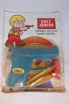 Rare Ancien PISTOLET à FLECHETTES Jouet Toy -- COLT JUNIOR -- Neuf sous Blister - Photo 1/4