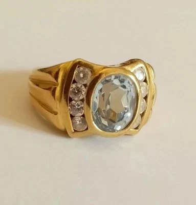 anello oro giallo 18ct donna topazio azzurro ovale 8 zirconia conica laterali - Immagine 1 di 2