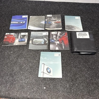 ☑️ Libro manual del propietario 2010-2013 OEM BMW E70 E71 X5M X6M con juego de billetera Foto 1 de 4