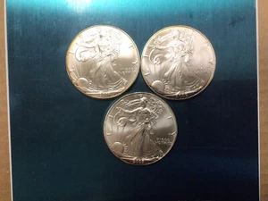 Lot Of 3 Silver Eagles, 2001, 2002, 2003, .999 Fine Silver, Toned, Spots (C10) - Picture 1 of 4