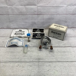 Vintage Shimano Bantam 100 Baitcastrolle mit Box Anleitung guter Zustand - Bild 1 von 17